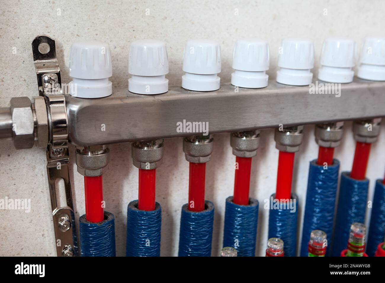 Heat carrier return manifold with PEX pipe contours, water heated floor