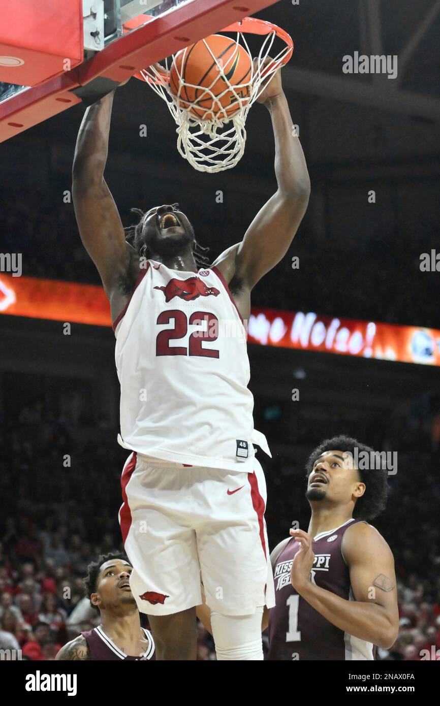 Arkansas forward Makhel Mitchell (22) dunks the ball against Mississippi State during an NCAA