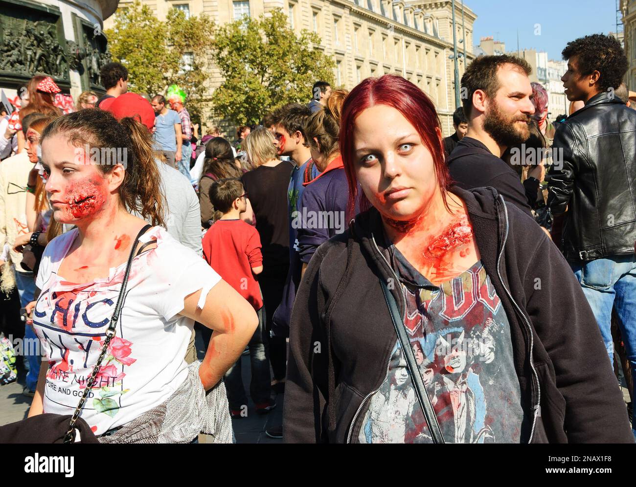 PARIS, FRANCE - OCTOBER 3, 2015: Two girls in zombie costume participating in Zombie parade at Place de la Republique. Zombie Walk is an annual event Stock Photo