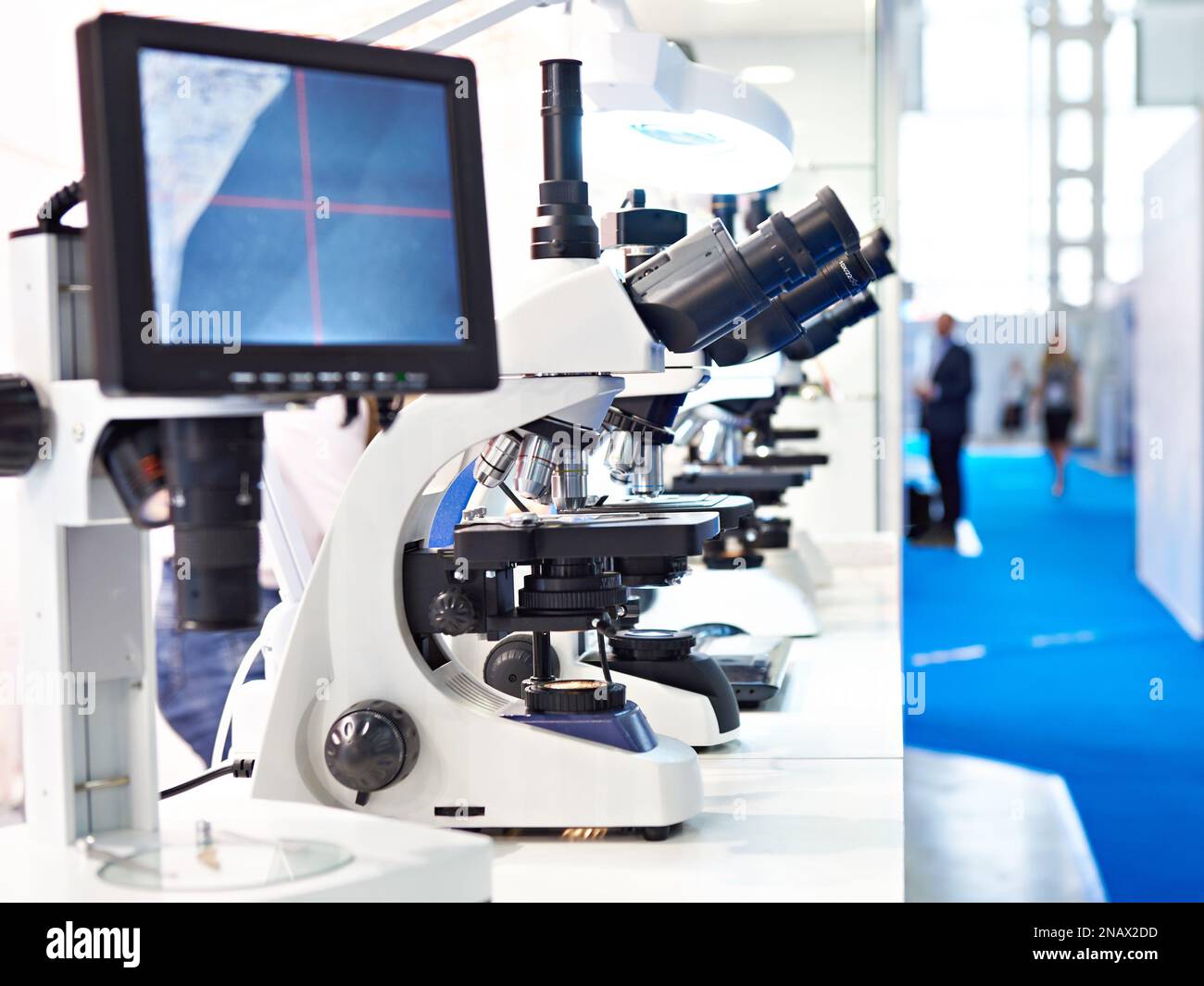 Stereo microscopes with computers monitor on exhibition Stock Photo Alamy