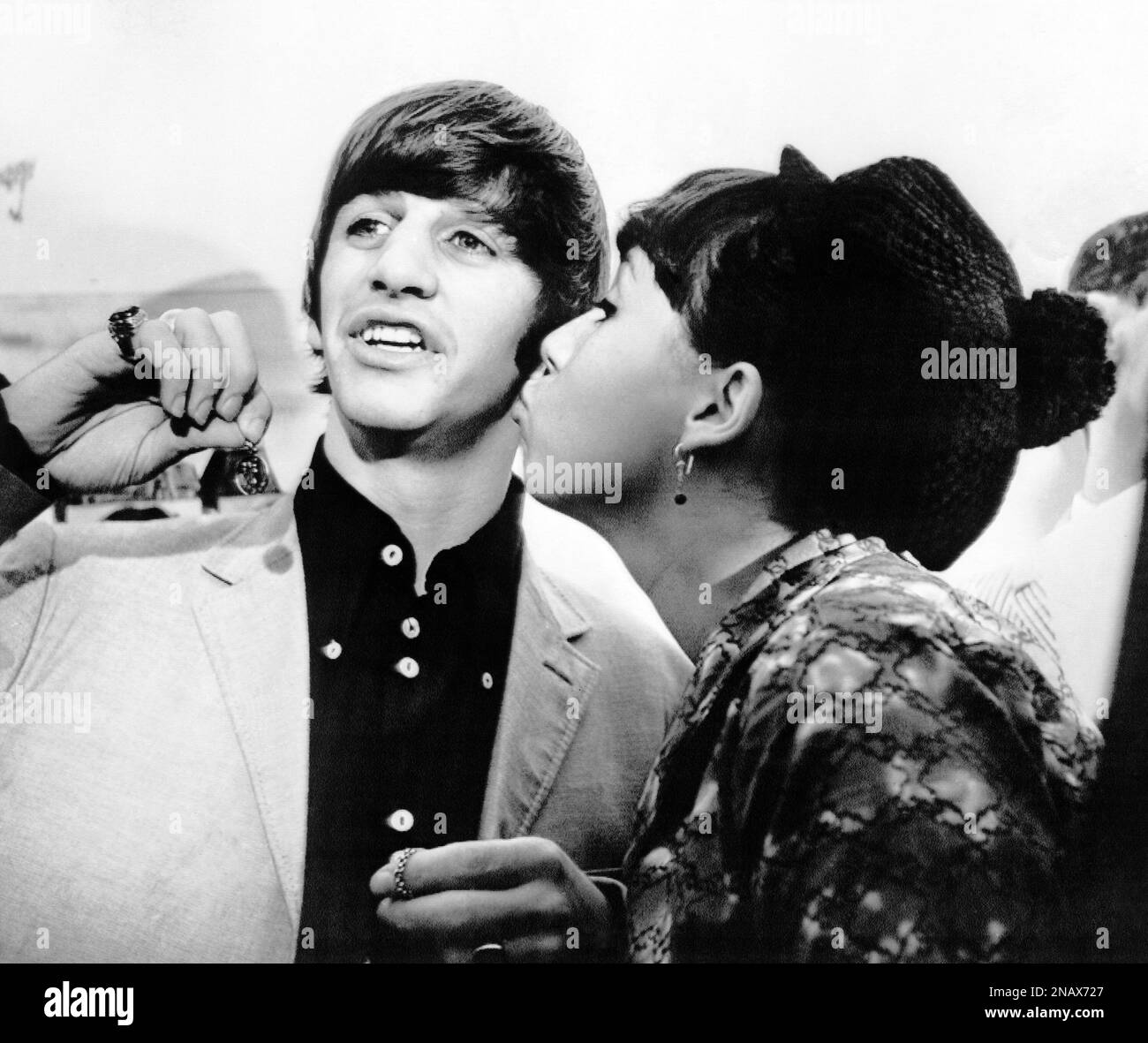 Angie McGowan, 16, plants a kiss on the cheek of Beatle drummer Ringo ...