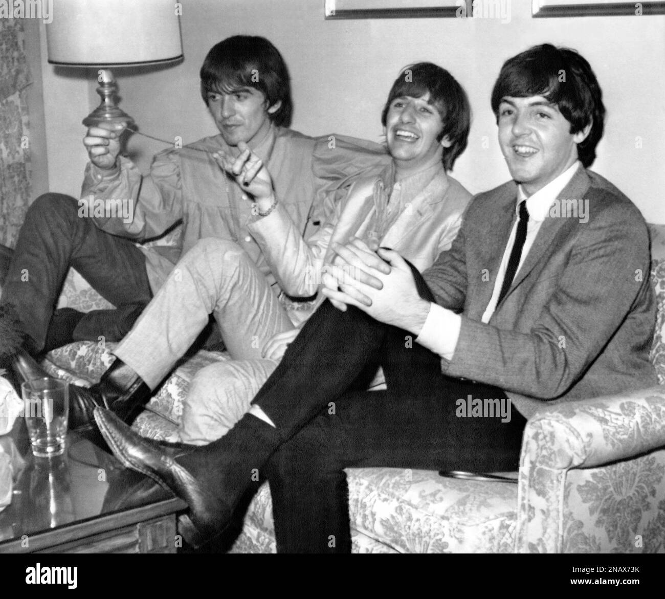 Beatle Ringo Starr, center, holds up necklace which he said someone ...