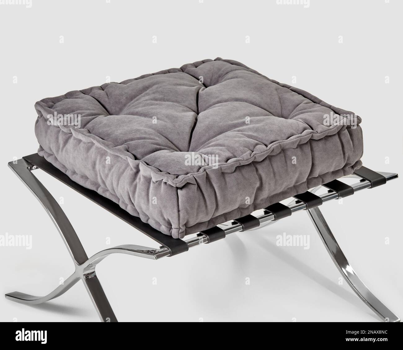 Soft grey velvet seat cushion on metal ottoman Stock Photo Alamy