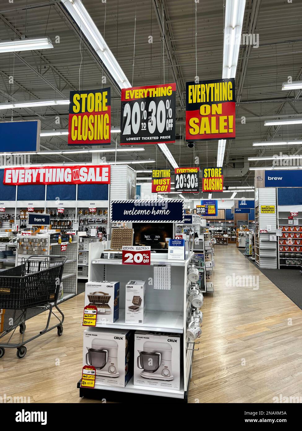Signs inside a Bed, Bath, and Beyond store in Wilmette, IL announcing that everything is on sale because the store is closing. Stock Photo