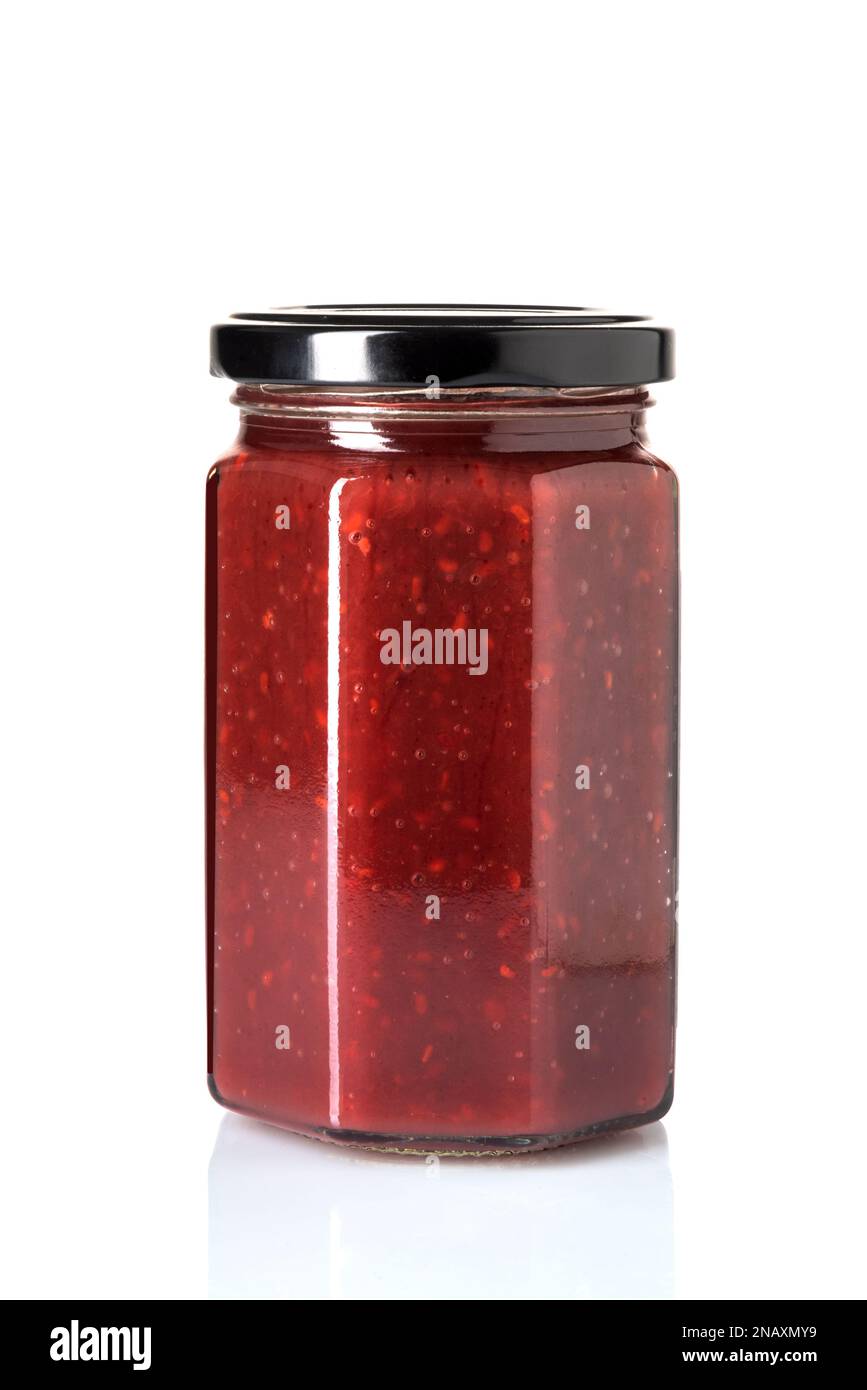 Raspberry jam in glass jar with black cap isolated on white with ...