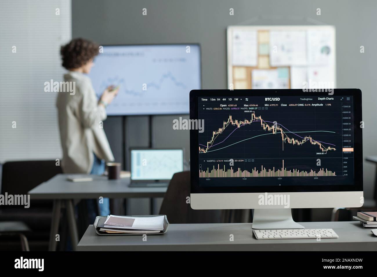 Computer screen with financial statistics illustrated by graph and ...