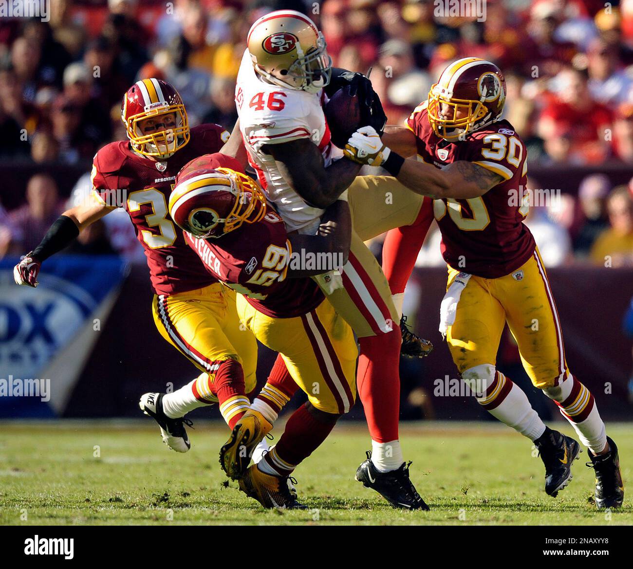 Laron Reed San Francisco 49ers tight end Delanie Walker (46) is tackled Washington ...