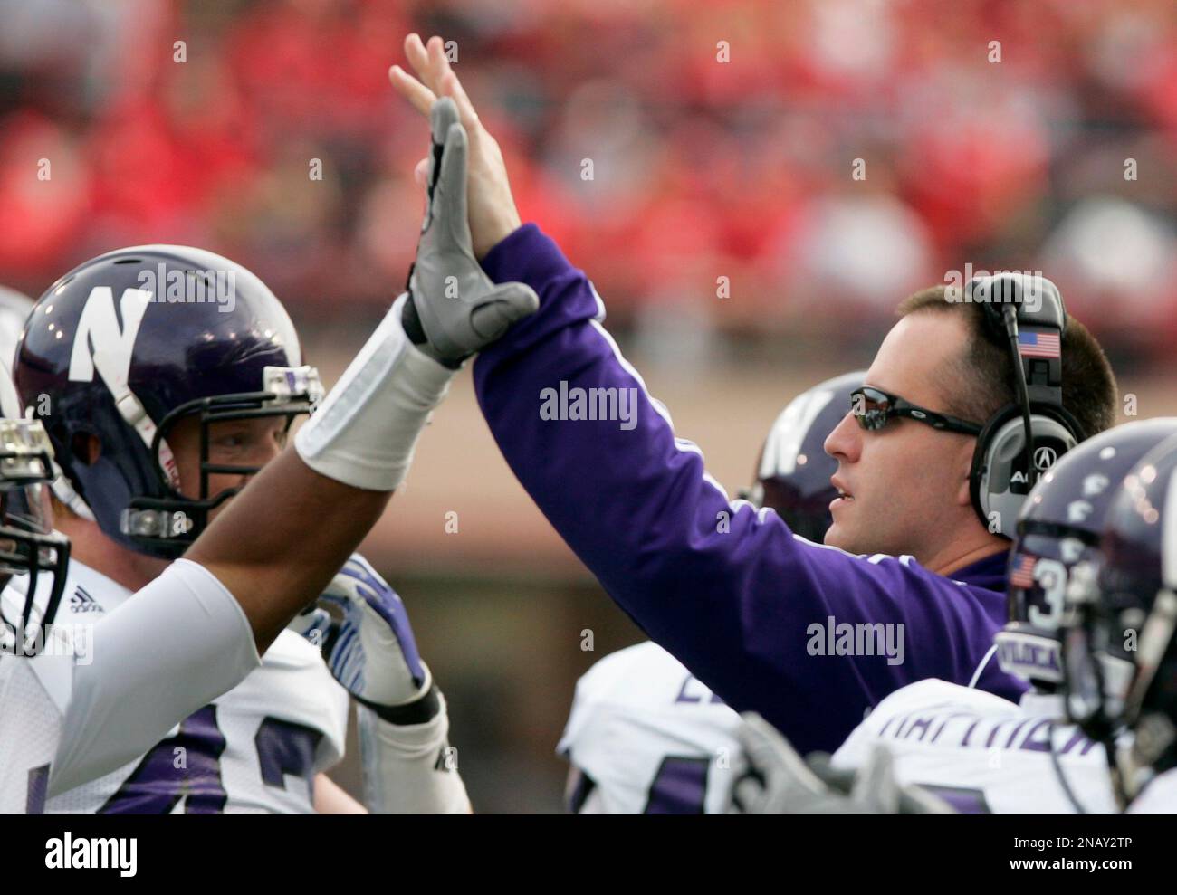 Northwestern's head coach Pat Fitzgerald highfives Ibraheim Campbell