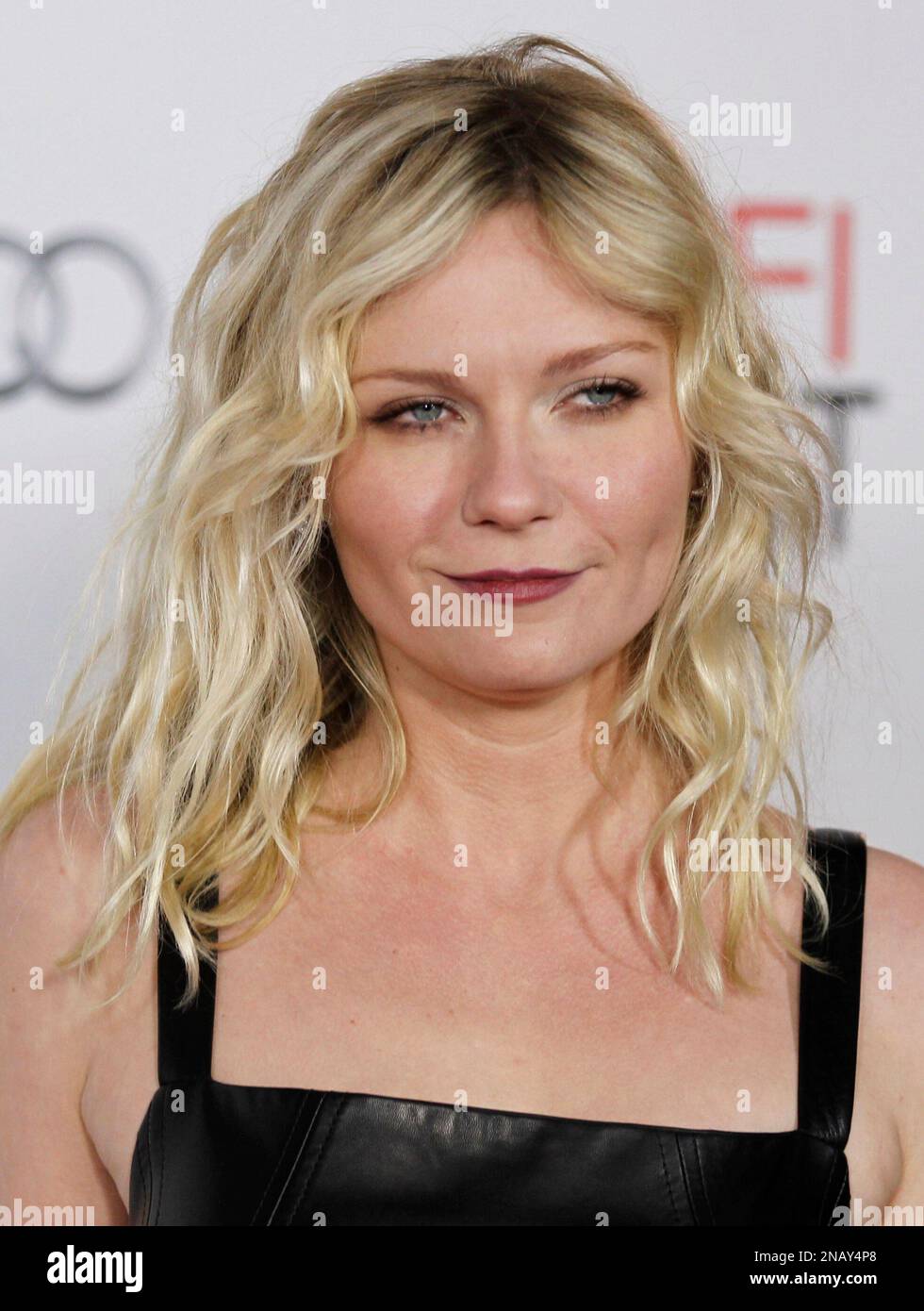 Actress Kirsten Dunst poses for photographers after the Young Hollywood
