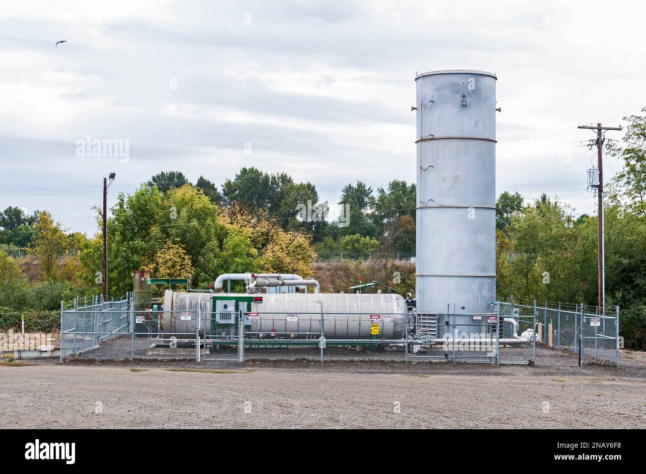 A fenced area containing tanks for methane gas which is generated by and in an active landfill