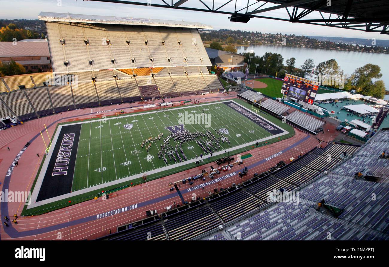 In this photo taken Oct. 29, 2011, the Husky Stadium field and Lake Washington, right, are seen from the press box before an NCAA college football game against Arizona in Seattle. Husky Stadium in its current state, with a setting nearly impossible to match in all of college football, will host its final football game in Saturday night's send-off between Washington and No. 6 Oregon. Much of it will be demolished and replaced with a $250 million upgrade. The purple ring around the field marks the bowl for the new stadium. (AP Photo/Elaine Thompson) Stock Photo