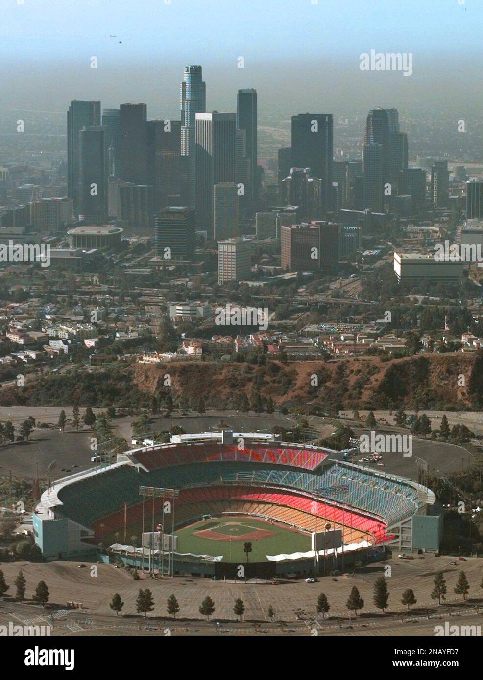 FILE - This Oct. 3, 1995 file photo is an aerial view of Dodger Stadium  with the downtown Los Angeles skyline in the background. Embattled Los  Angeles Dodgers owner Frank McCourt and