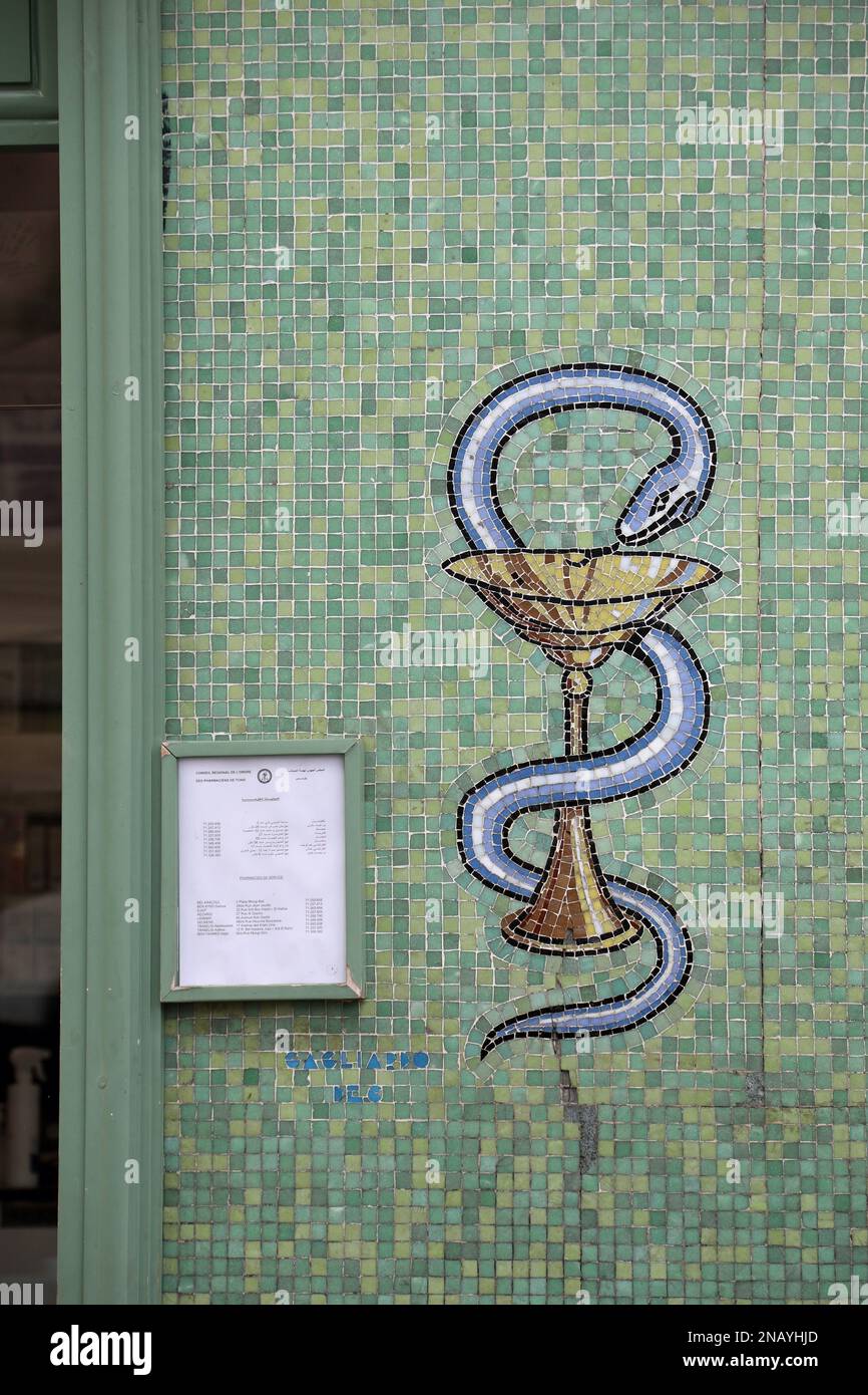 Mosaic snake and bowl pharmacy sign in Tunis Stock Photo