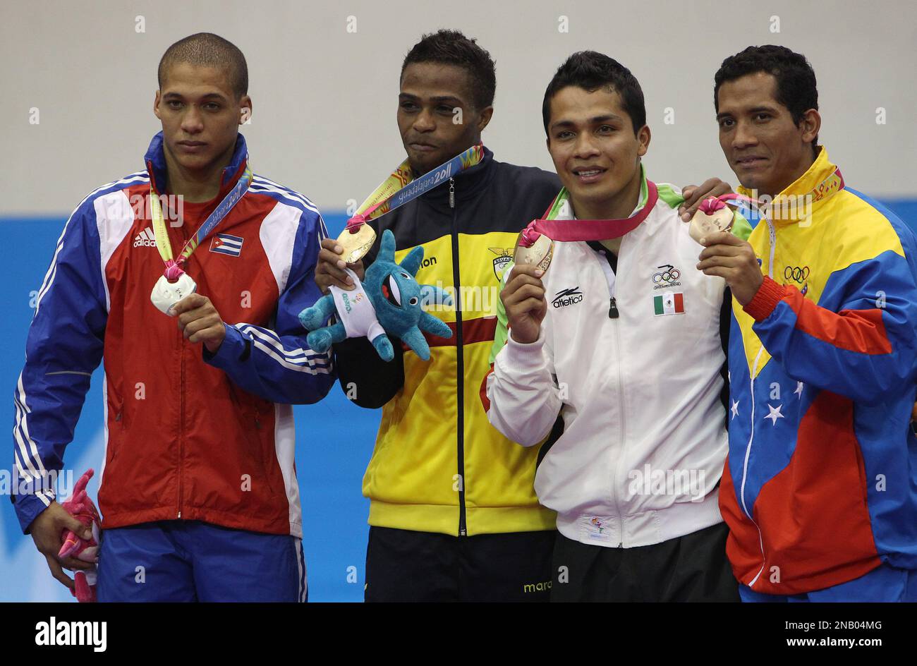 Athletes, from left to right, silver medalist Cuba's Dennis Novo, gold