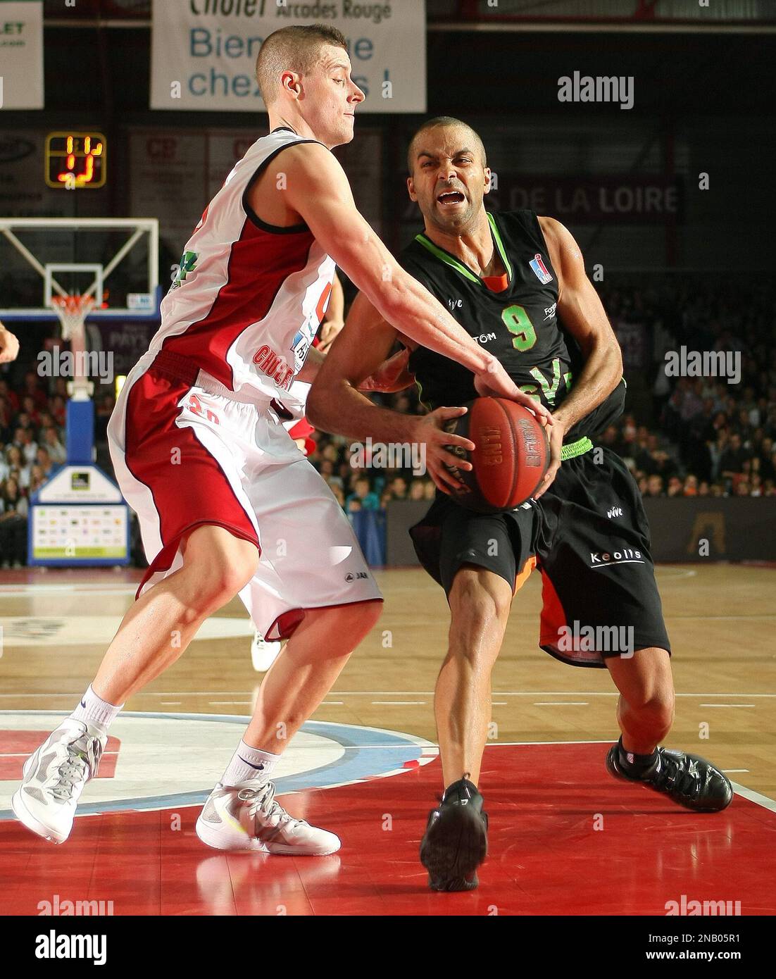 ASVEL's Tony Parker of France drives against Cholet's Donnie McGrath during  their French ProA basketball match in Cholet, western France France,  Saturday, Oct. 29, 2011. Vice President of the club, Parker will