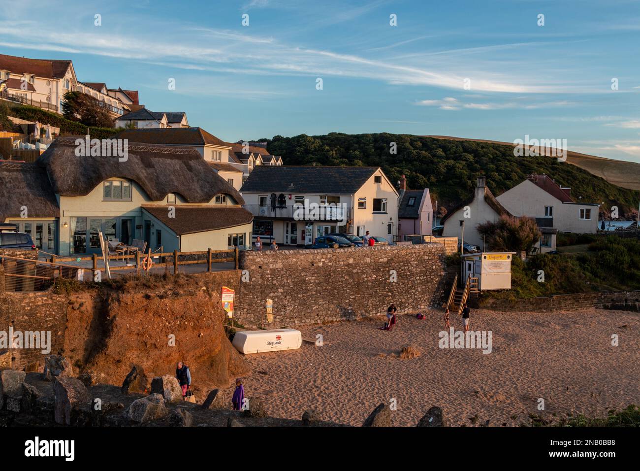 A view across Mouthwell Sands beach in Hope Cove, Devon, at sunset. Stock Photo