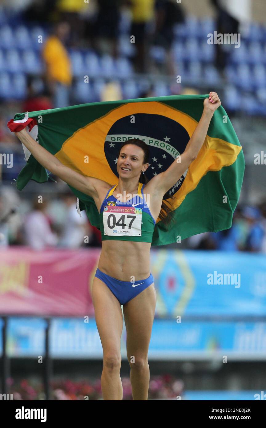 Brazil's Maurren Maggi celebrates after winning the gold medal at the end of the women's long jump final at the Pan American Games in Guadalajara, Mexico, Wednesday, Oct. 26, 2011. (AP Photo/Silvia Izquierdo) Stock Photo