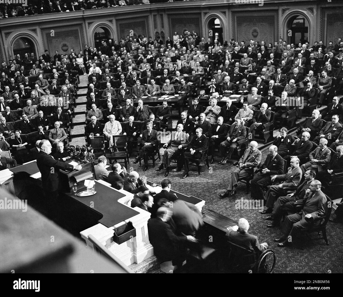 Addressing grave faced members of Congress, President Franklin D ...