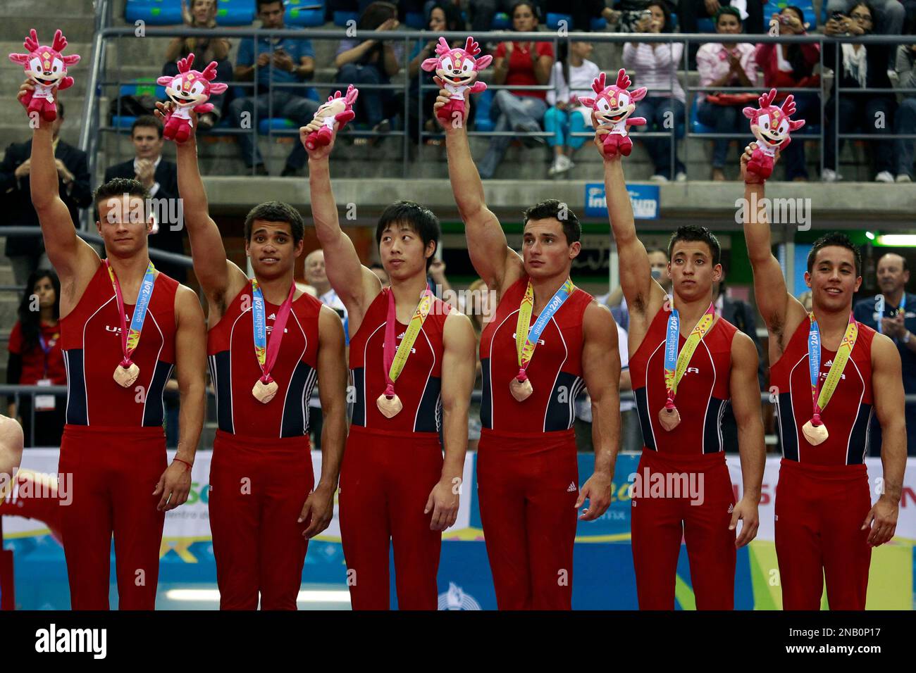 The United States team poses for pictures at the podium after winning ...