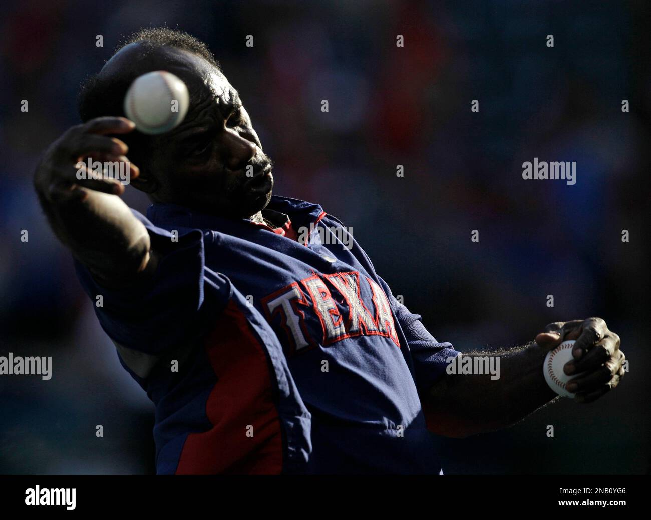 Texas Rangers manager Ron Washington throws batting practice before