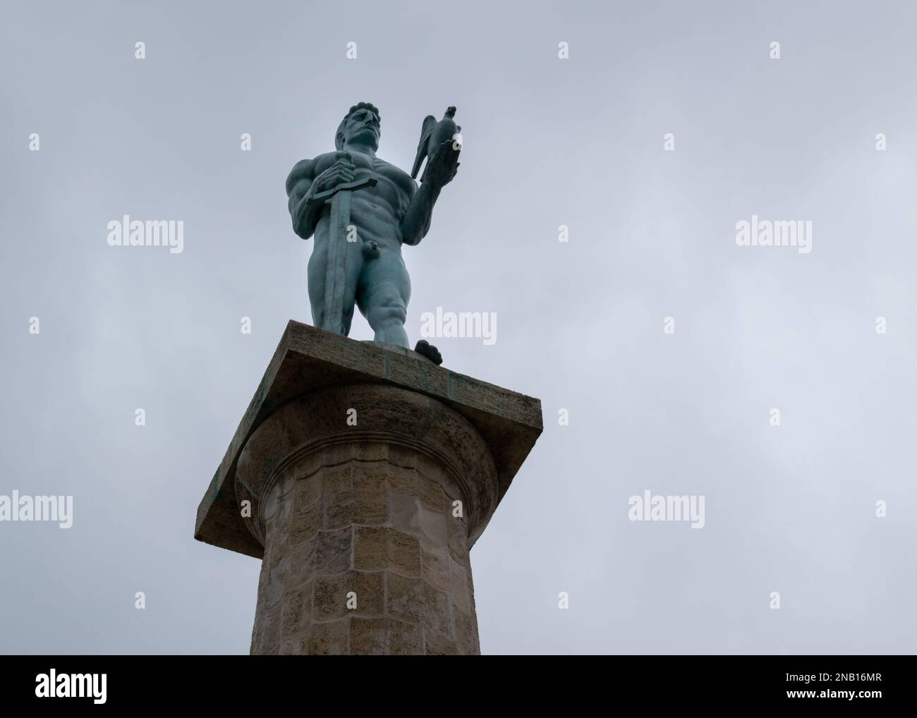 Victor statue at Belgrade park Kalemegdan close up against overcast sky Stock Photo