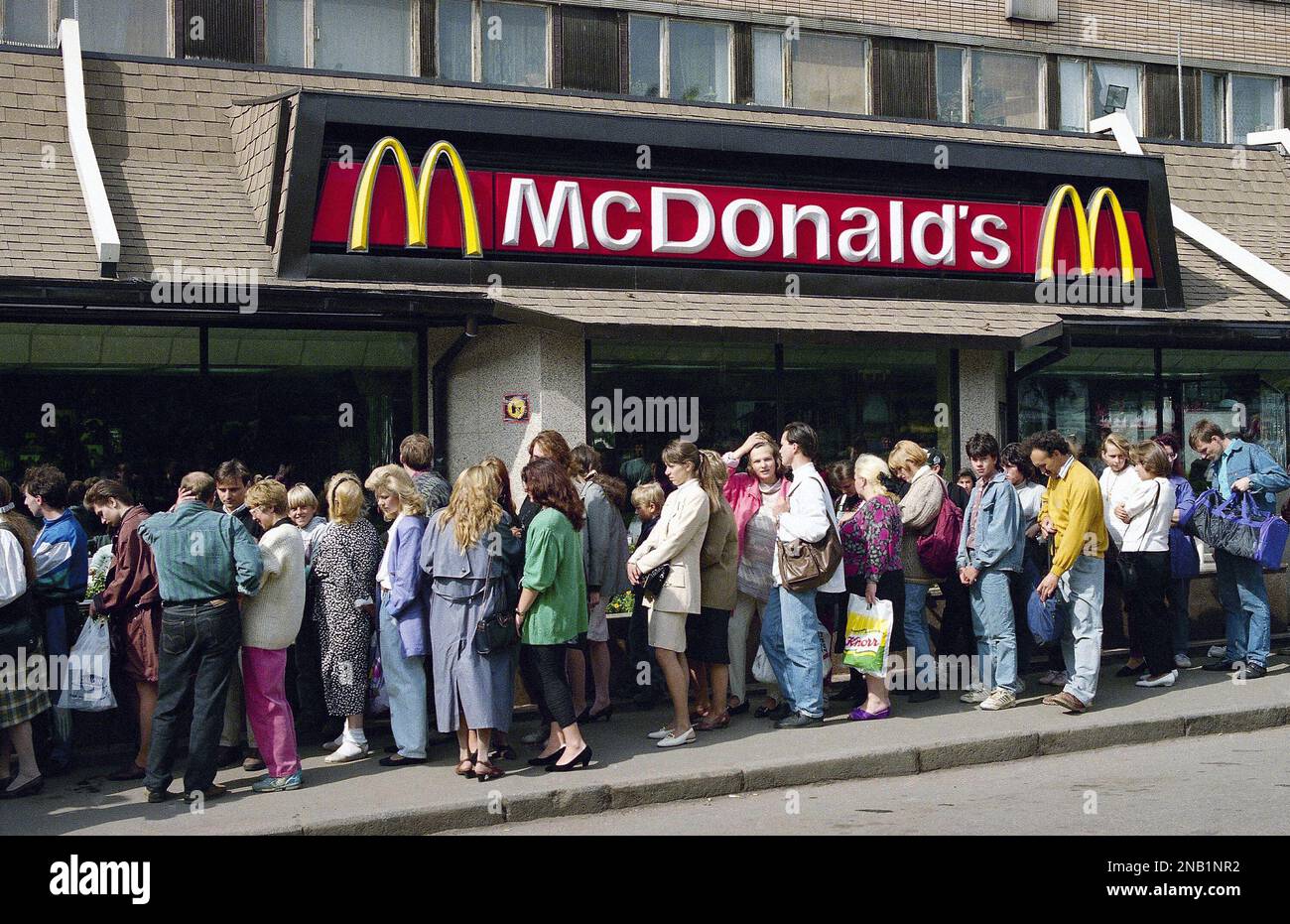 People stand in a long line in front of McDonald’s in Moscow’s Pushkin