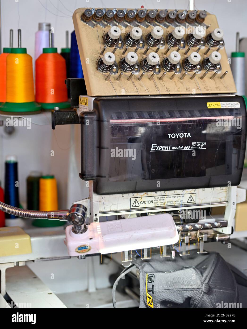 Multi colour six head twelve needle commercial embroidery machine