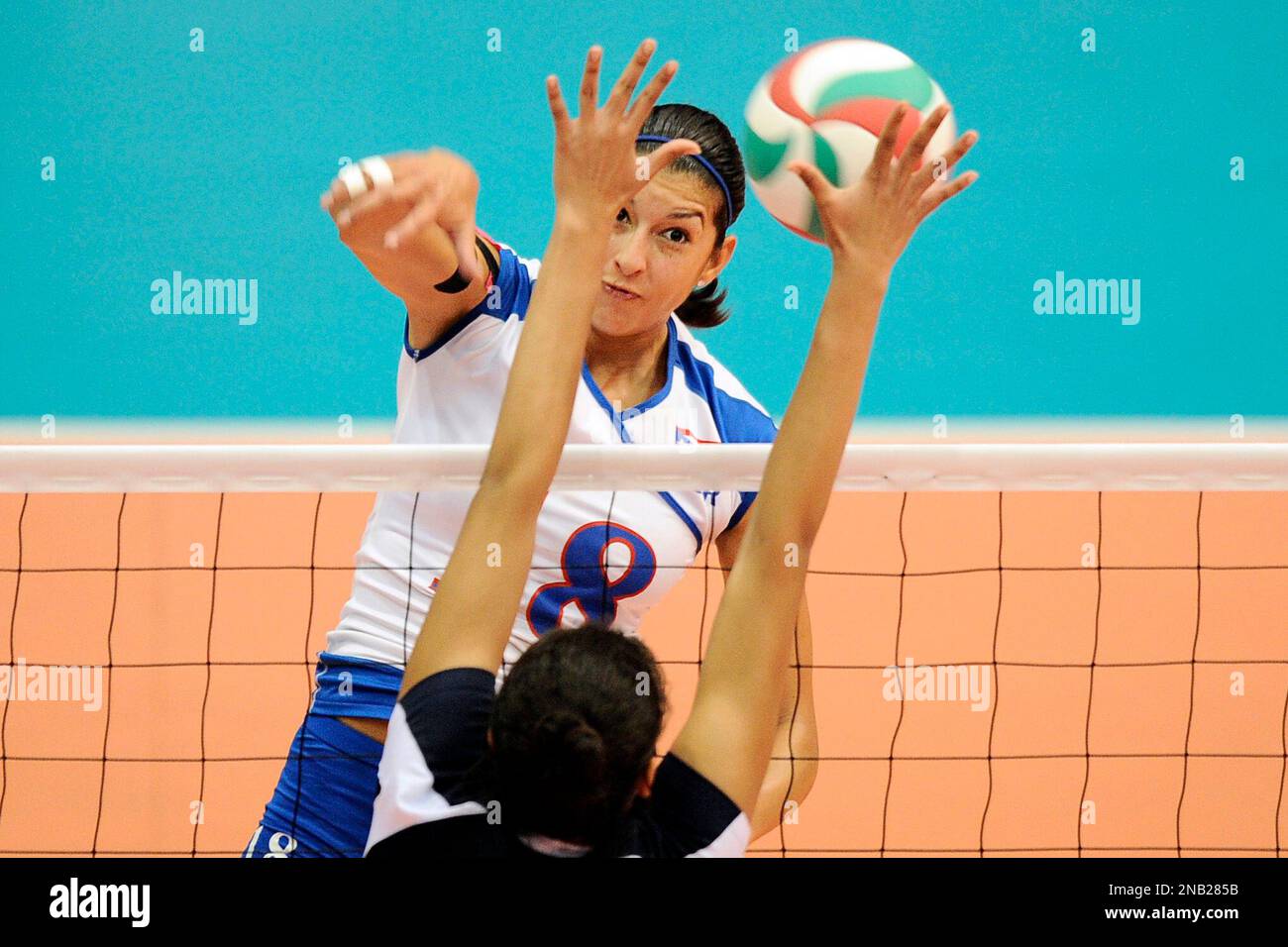 Lynda Morales from Puerto Rico spikes the ball during a women's