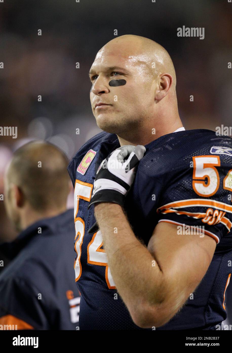 Chicago Bears linebacker Brian Urlacher (54) watches the action on the  sidelines in the second half of an NFL football game against the Minnesota  Vikings in Chicago, Sunday, Oct. 16, 2011. The