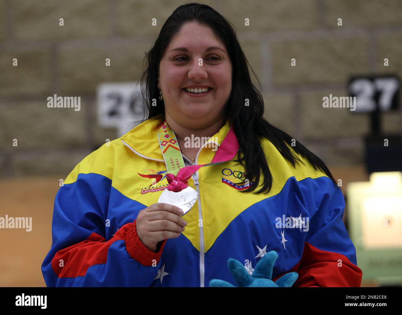 Silver medal winner Venezuela's Maribel Pineda poses for pictures