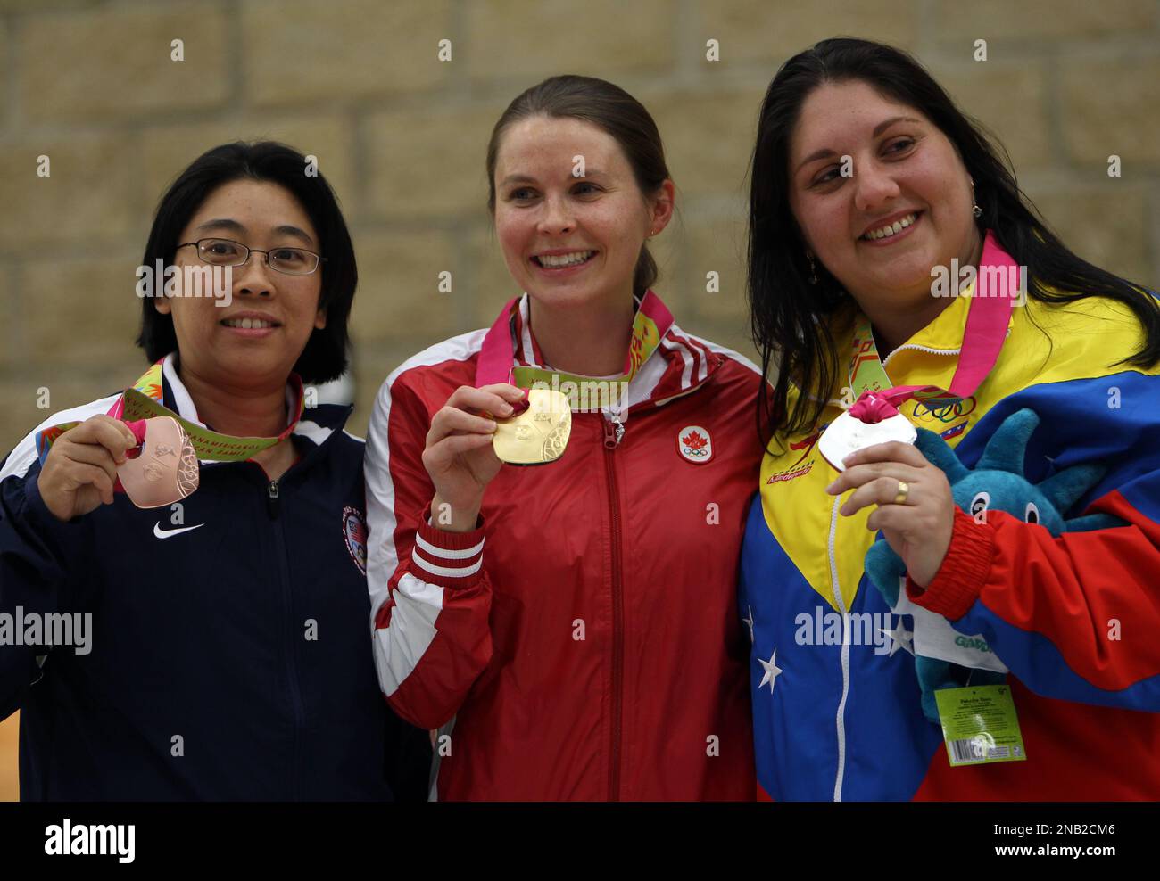 Gold medal winner Canada's Dorothy Ludwing, center, silver medal winner