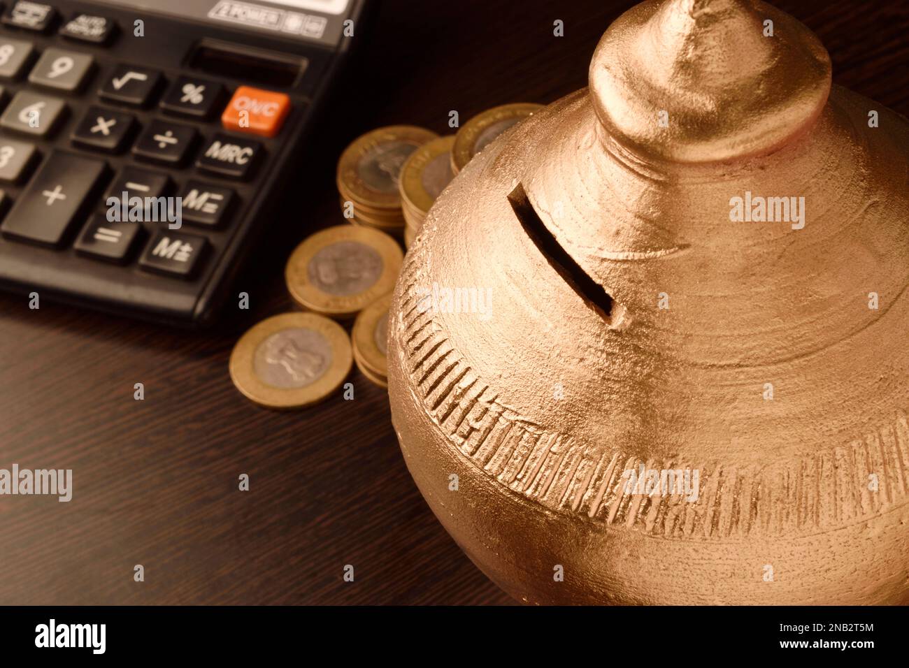 Traditional piggy bank gullak with money on the table, indian money