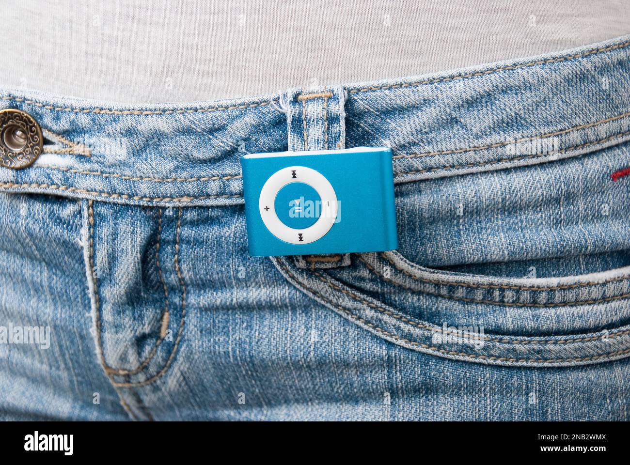 Blue mp3 player isolated on jean. Stock Photo