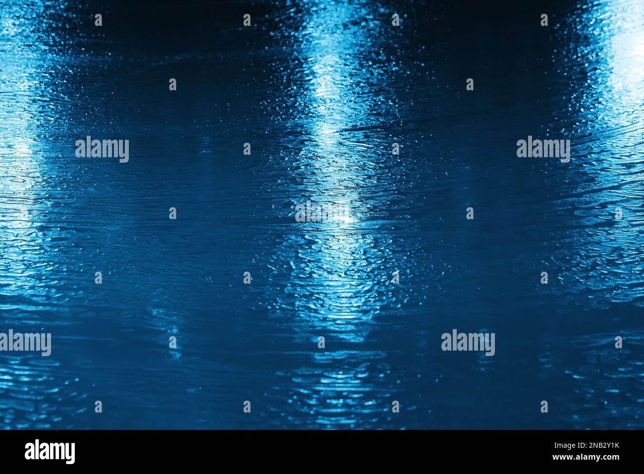 Blue ice rink texture with shiny lights reflections, abstract ...