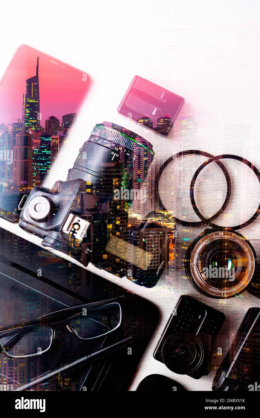 Concept photography background with double exposure. Modern photojournalism and city.Professional Photographic Equipment. Work kit for professional. Stock Photo