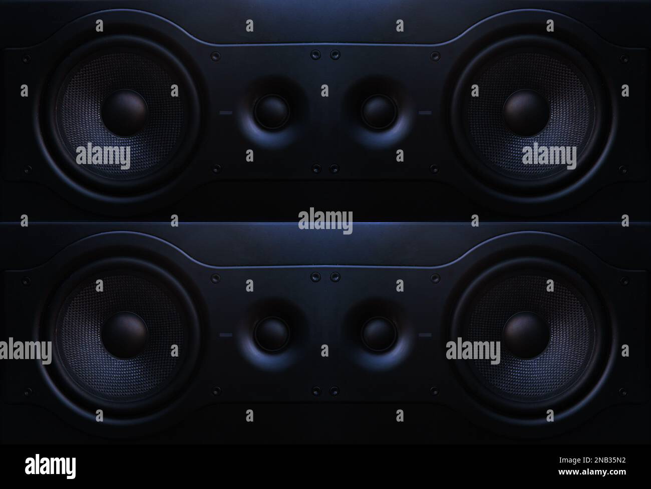 Two way speaker in recording studio.Photo in black, isolated on black background.Front image audio speaker with undulating membrane. Stock Photo