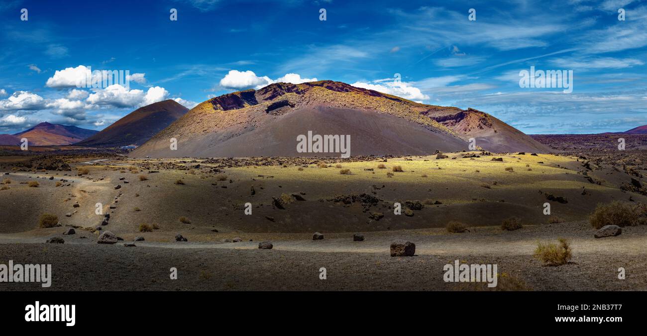 Scenery mountains,volcanoes and craters in wild landscape.Volcanic landscape at Timanfaya National Park, Lanzarote Island, Canary Islands, Spain. Stock Photo