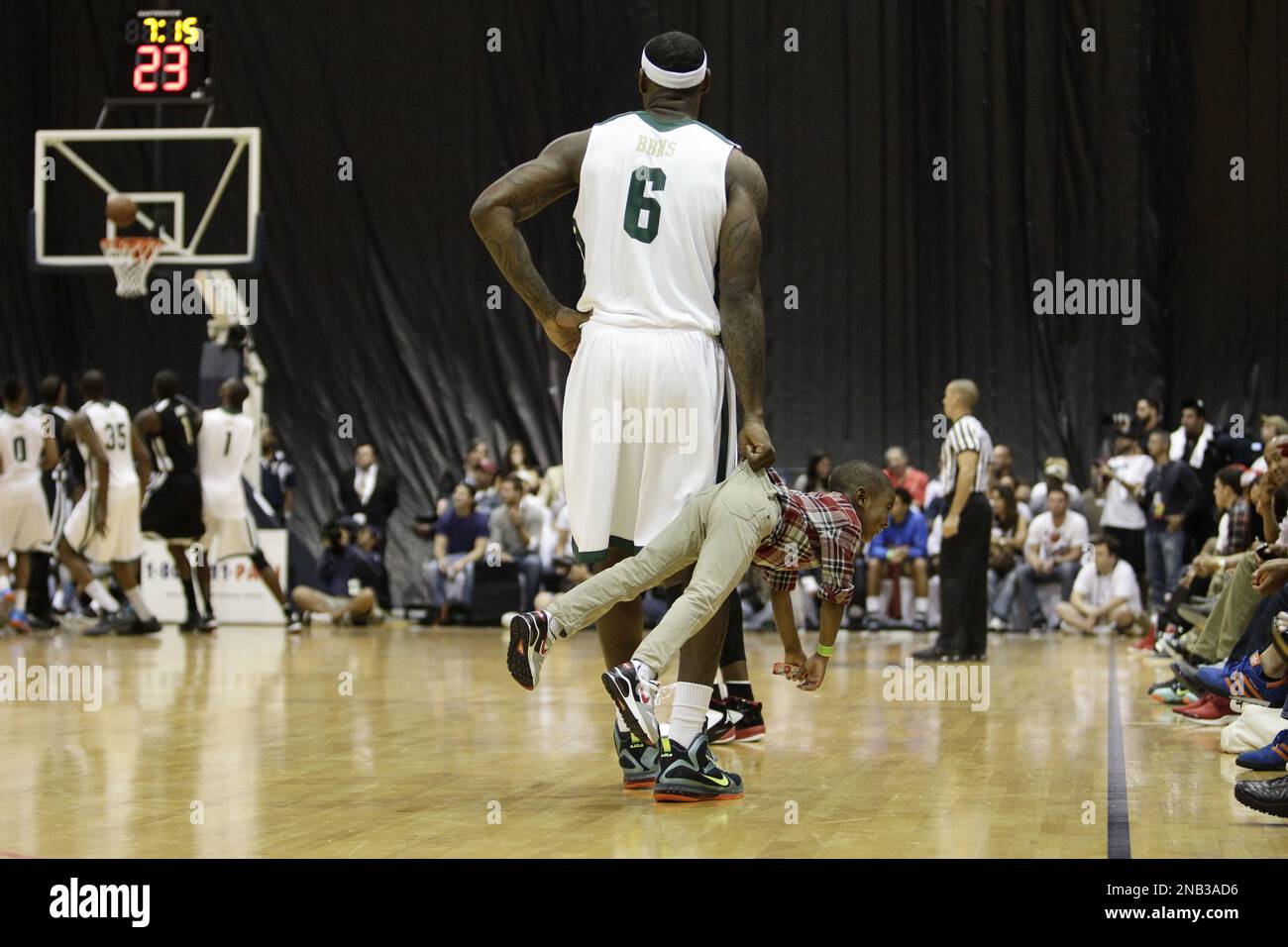 Miami Heat's LeBron James plays with his son, Bryce, during the South