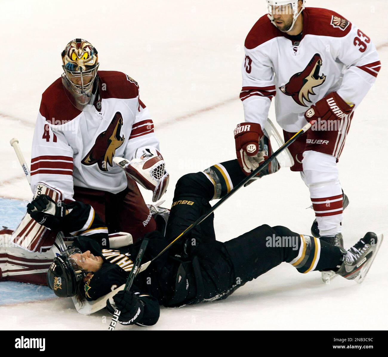 Dallas Stars right wing Adam Burish (16) is knocked to the ice by