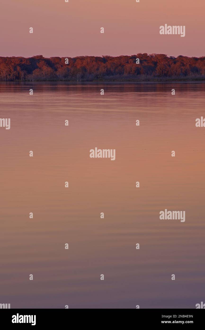 Tranquil lake sunset reflects hi-res stock photography and images - Alamy
