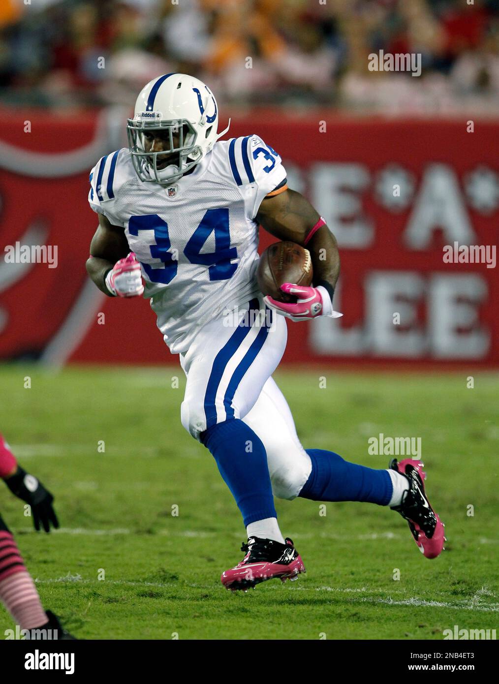 Indianapolis Colts running back Delone Carter (34) runs with the ball  against the Tampa Bay Buccaneers during the second half of an NFL football  game Monday, Oct. 3, 2011, in Tampa, Fla. (