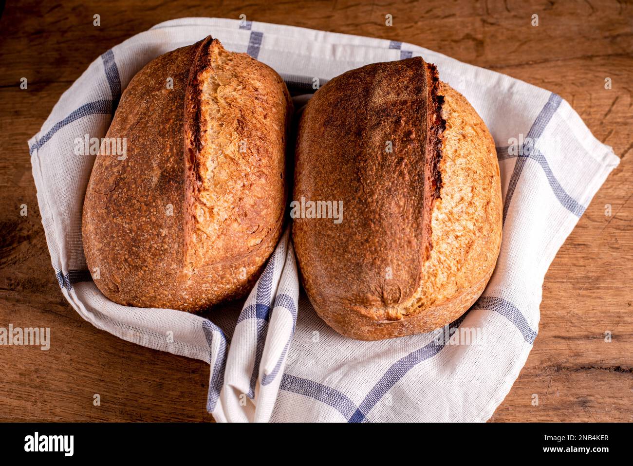 Home baked sourdough breads. Fresh, homemade sourdough breads. Stock Photo
