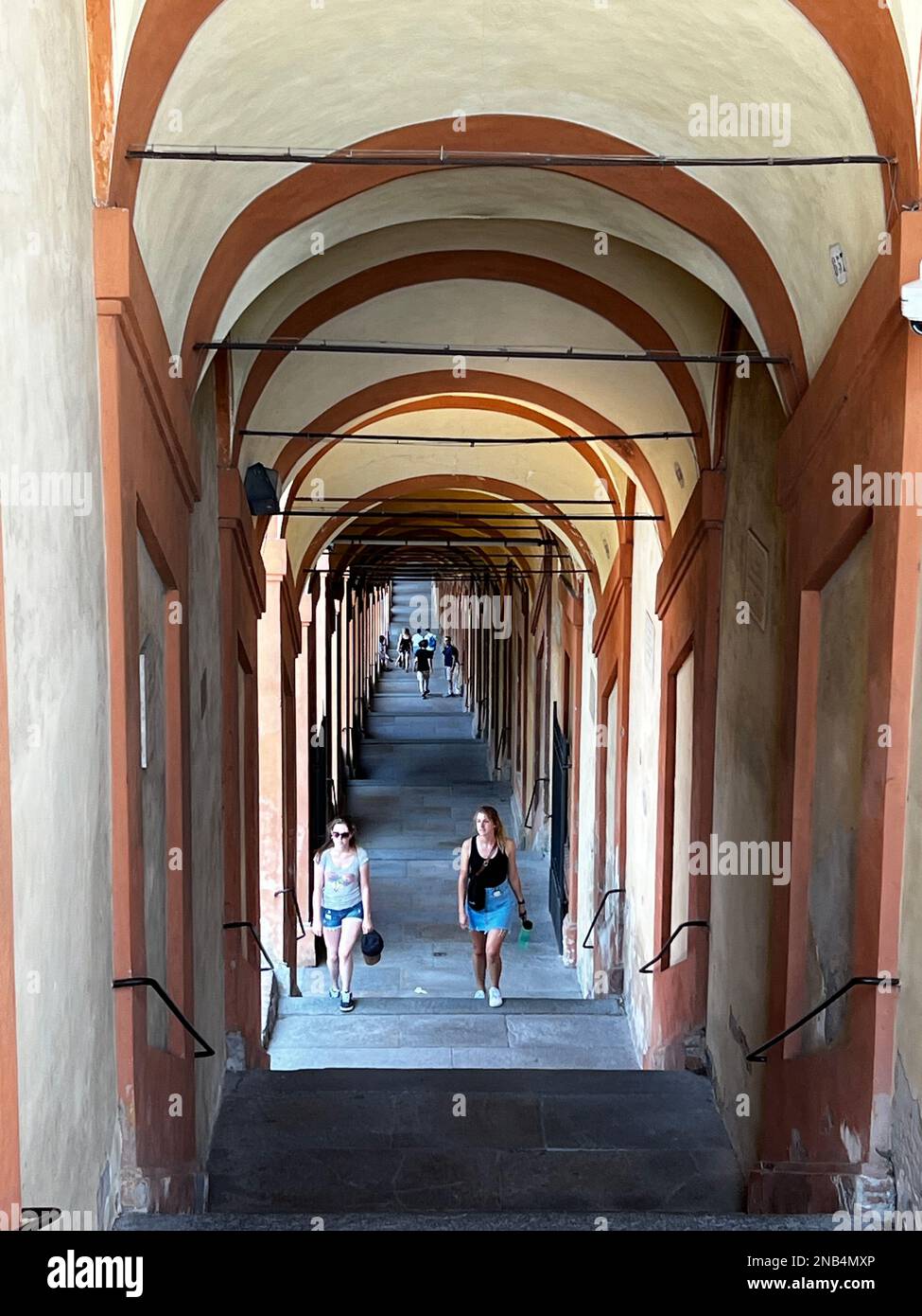Known as the City of Porticoes, Bologna Italy's network of covered porticoes extends over 24 miles (38 kilometers). The portico leading to the Sanctua Stock Photo