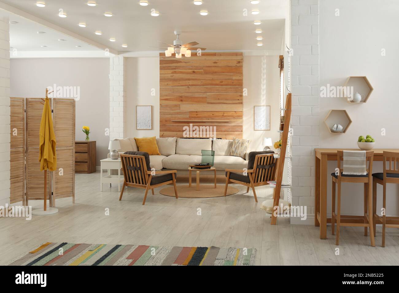 Stylish sofa in living room. Interior design Stock Photo - Alamy