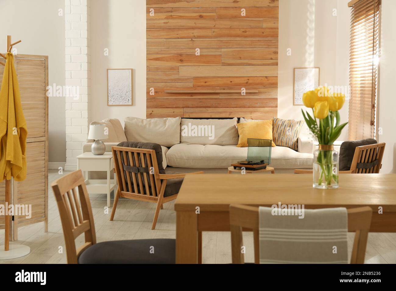 Stylish sofa in living room. Interior design Stock Photo - Alamy