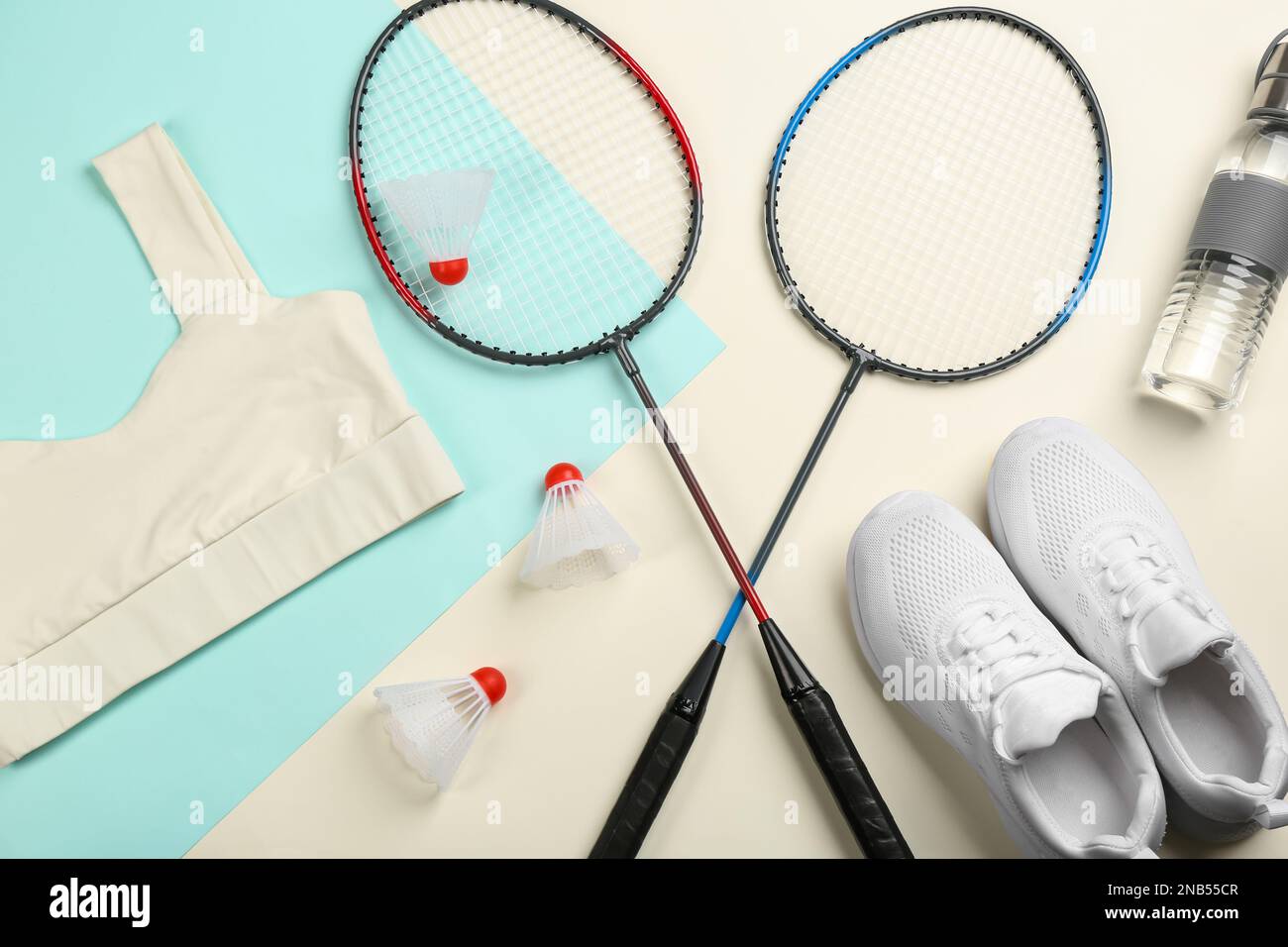 Flat lay composition with badminton rackets and shuttlecocks on color ...