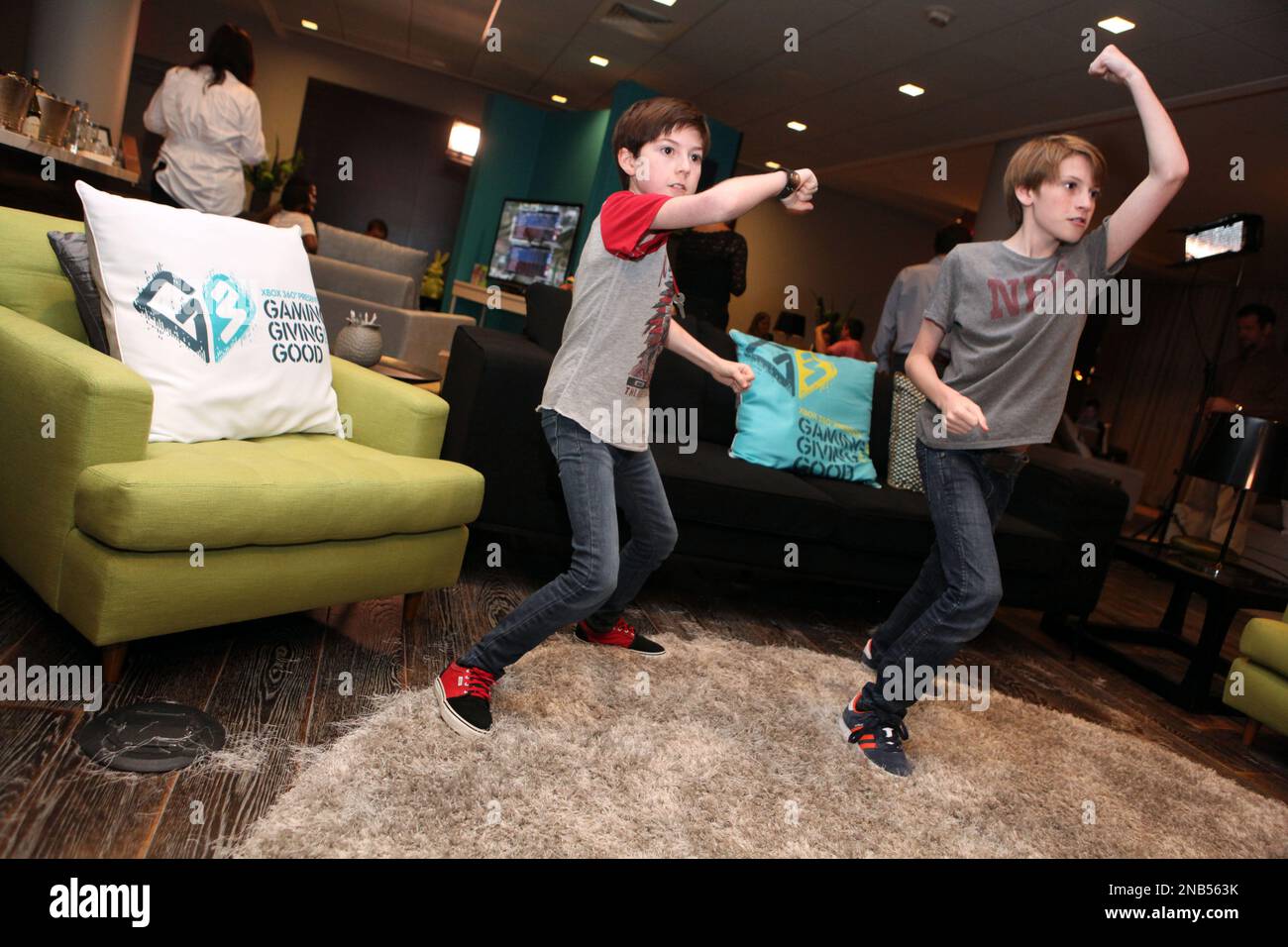 Mason Cook, left, and his brother Lane Cook are seen at the G3 Miracle  Lounge presented by Xbox 360 on Thursday, Sept. 29, 2011, in West  Hollywood, Calif. (Casey Rodgers/AP Images for