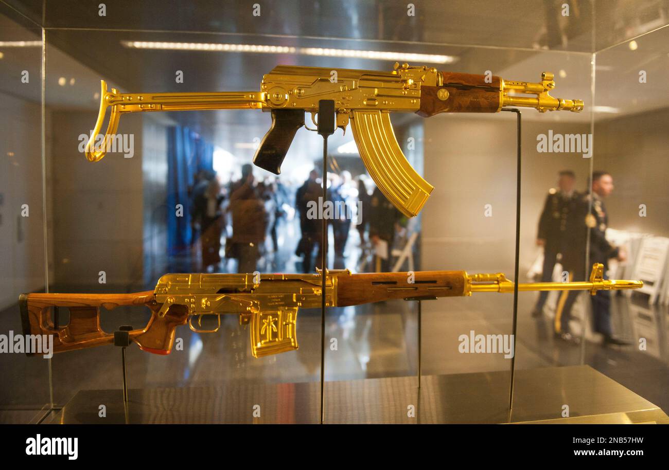 Former Iraq President Saddam Hussein's gold AK-47 assault rifle and ...