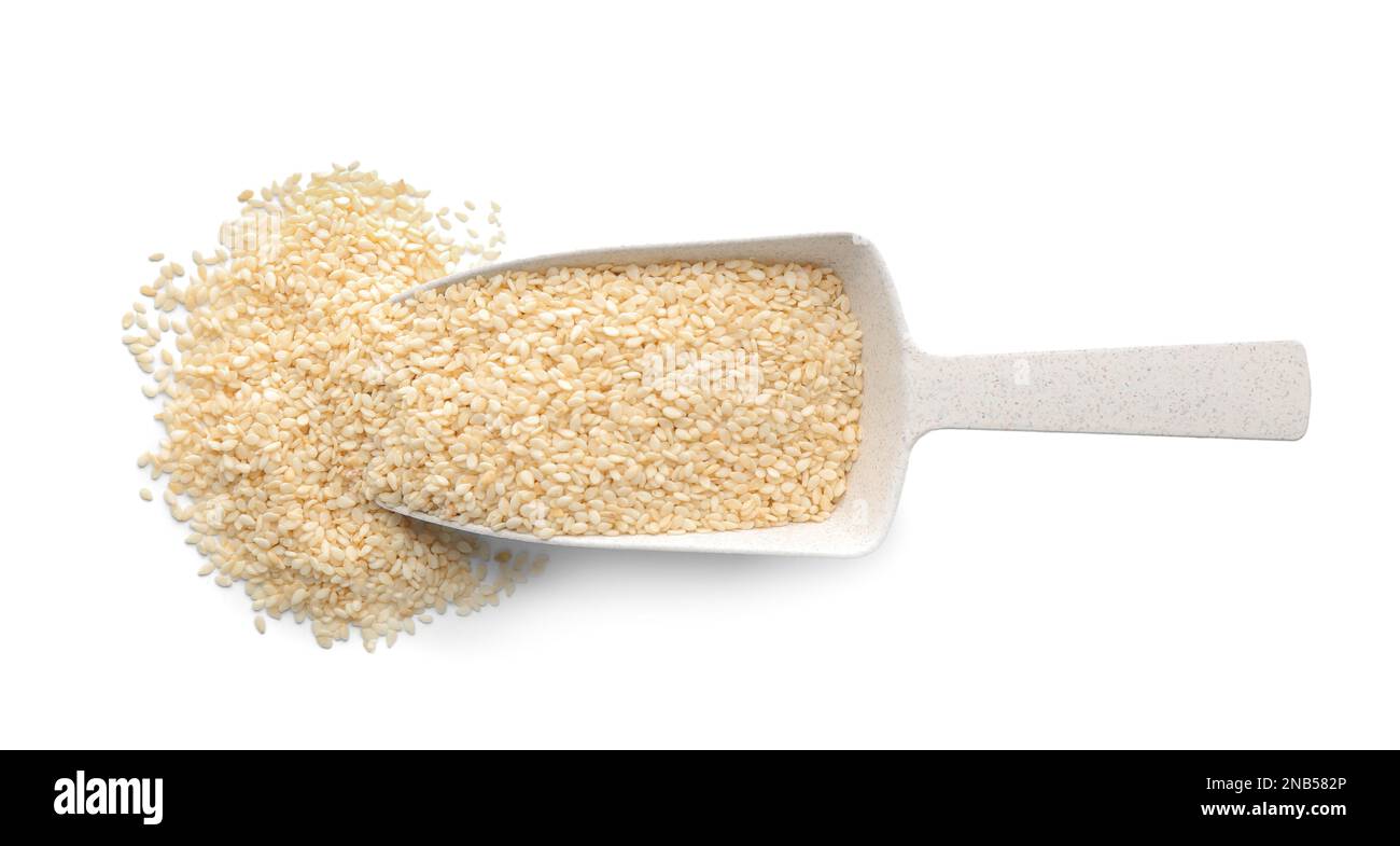 Plastic scoop with sesame seeds on white background, top view Stock Photo