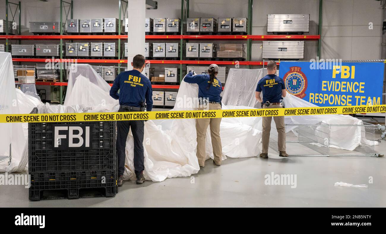FBI special agents assigned to the Evidence Response Team process material recovered from the high-altitude balloon recovered off the coast of South Carolina in early February 2023. In a news briefing on February 9, senior FBI officials detailed the Bureau’s role as the lead governing agency for the forensic examination of the Chinese high-altitude balloon identified and shot down February 5 by the U.S. military. Photo: Federal Bureau of Investigation Stock Photo